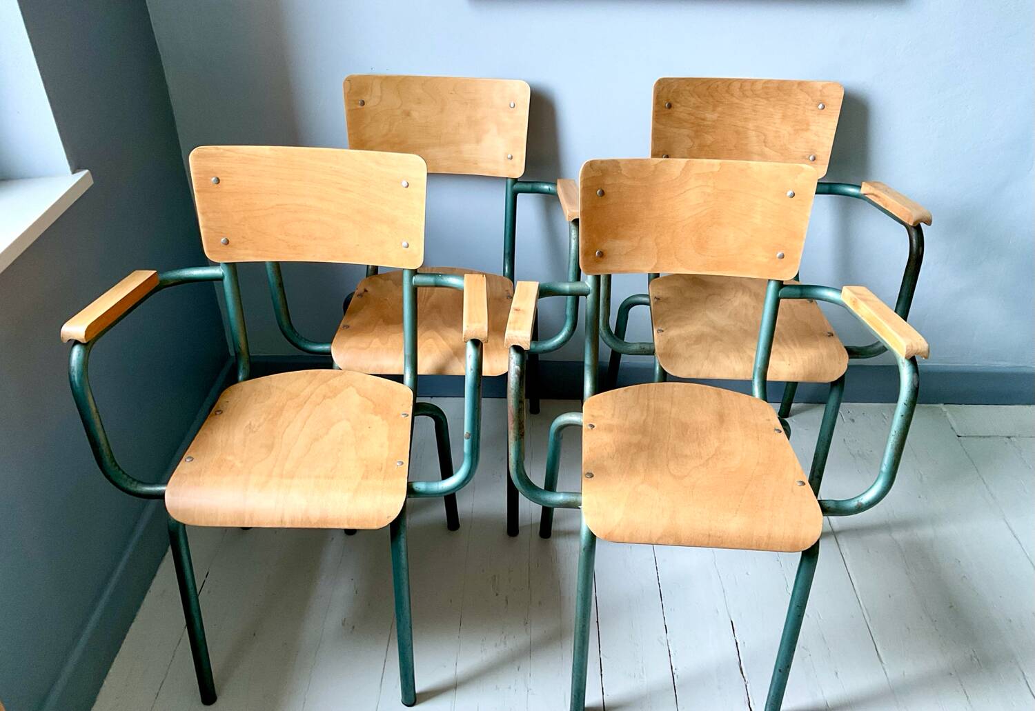 Set of four school teacher armchairs