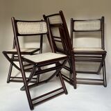Set de quatre chaises pliantes en bois et cannage