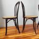4 antique curved wood and cane chairs