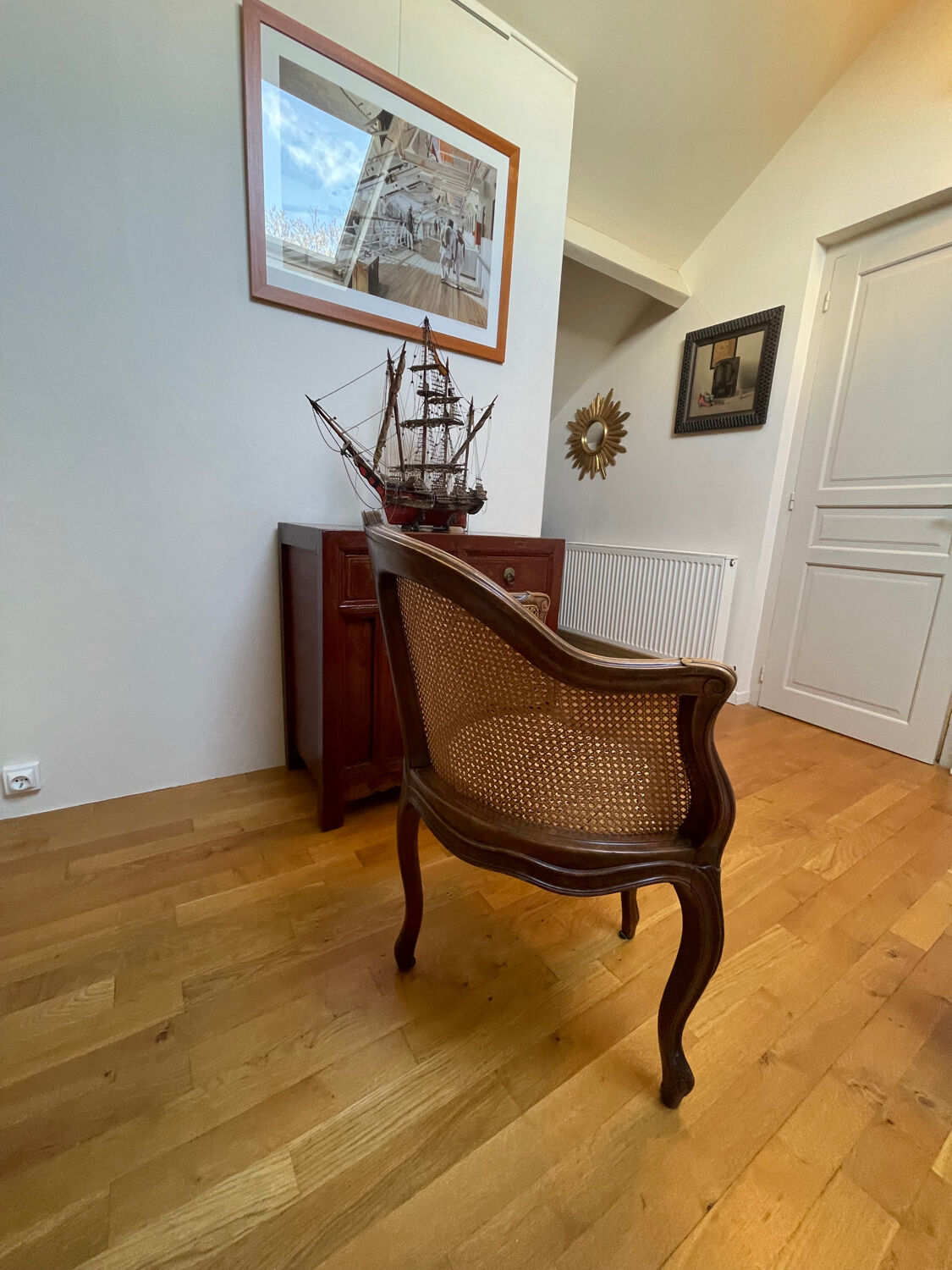 Cane seat armchair from the 19th century in the Louis XV style, known as "couillard".