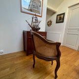 Cane seat armchair from the 19th century in the Louis XV style, known as "couillard".