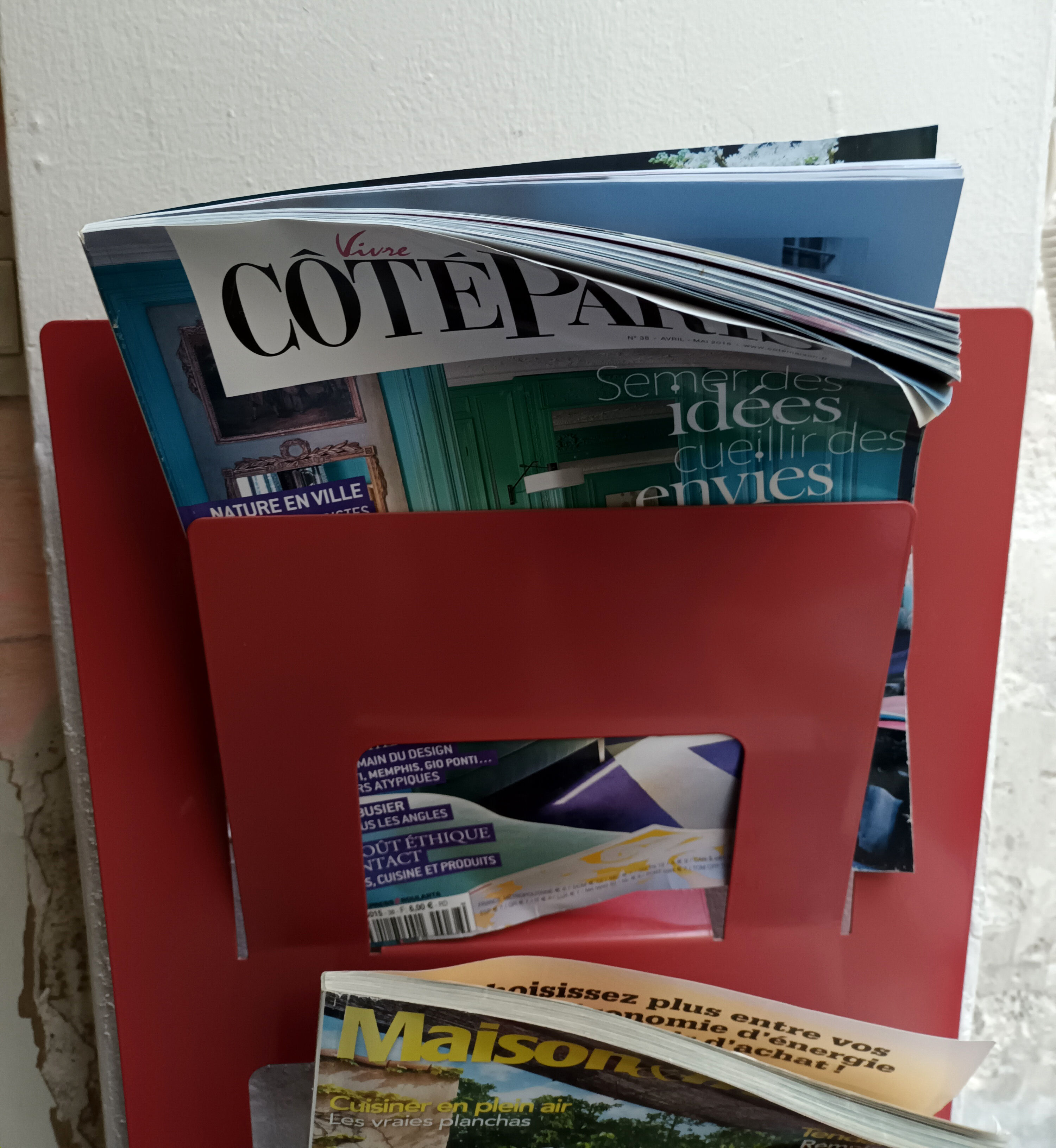 Vintage red metal wall magazine rack