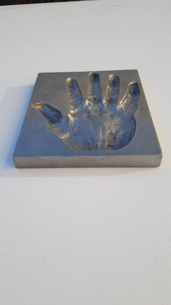 Trinket bowl hand print in 1970s aluminum