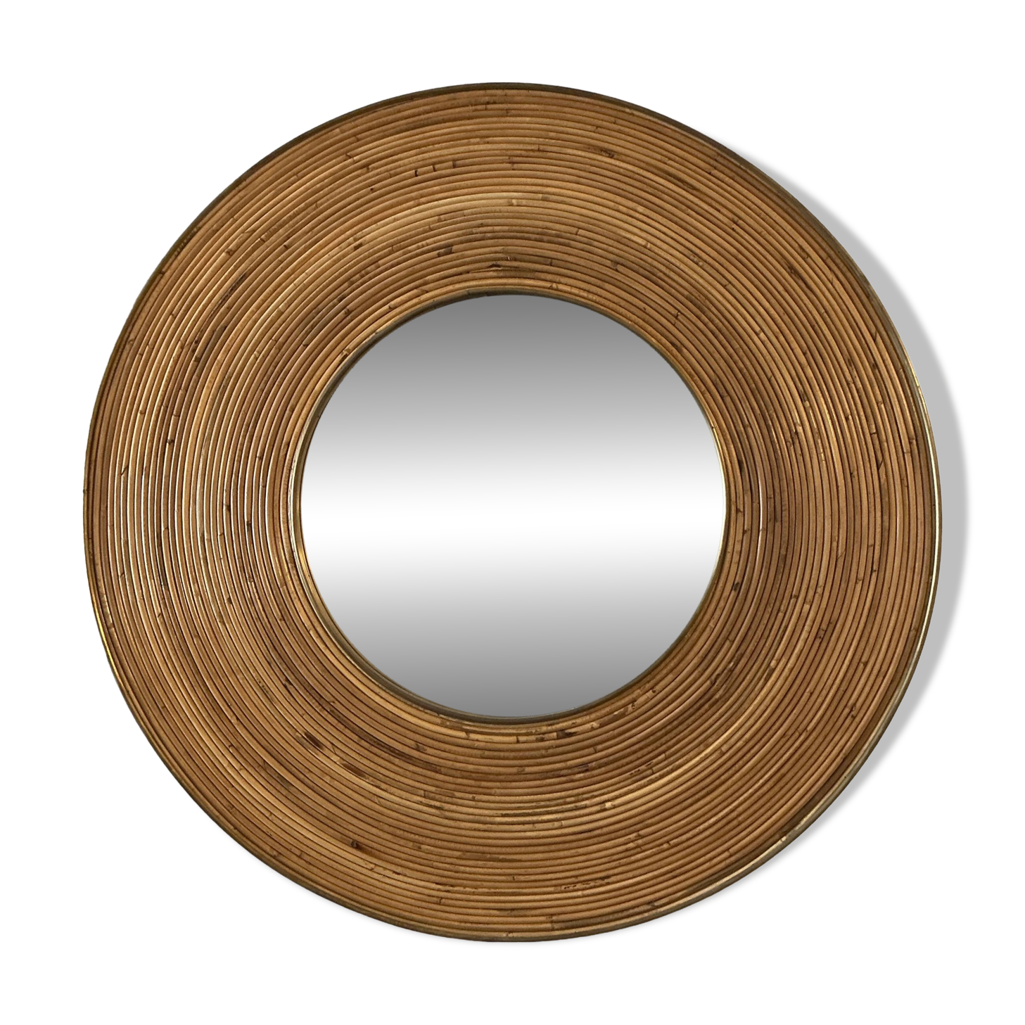 Large round mirror in rattan and brass