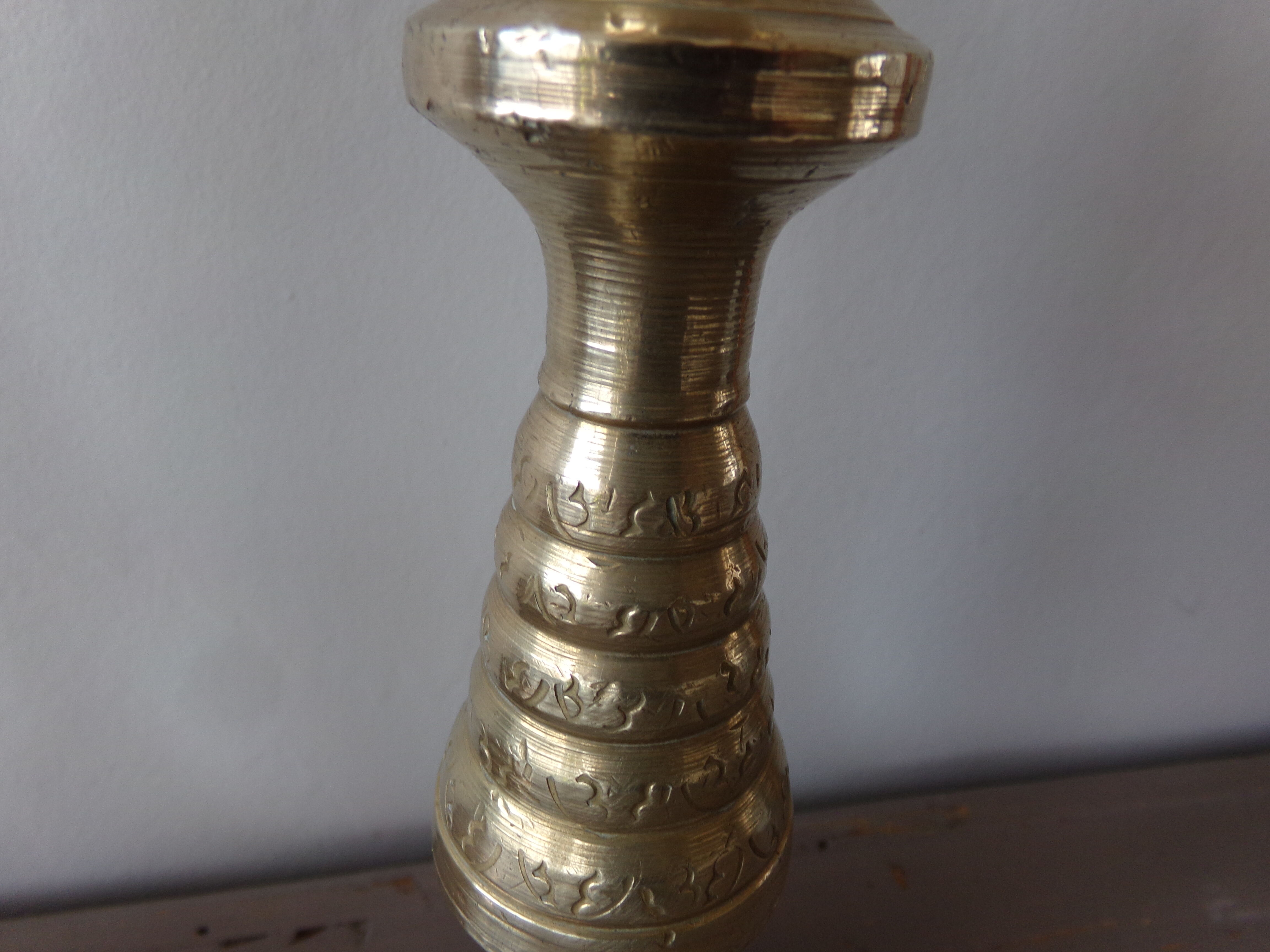 Old candle holder in gilded bronze