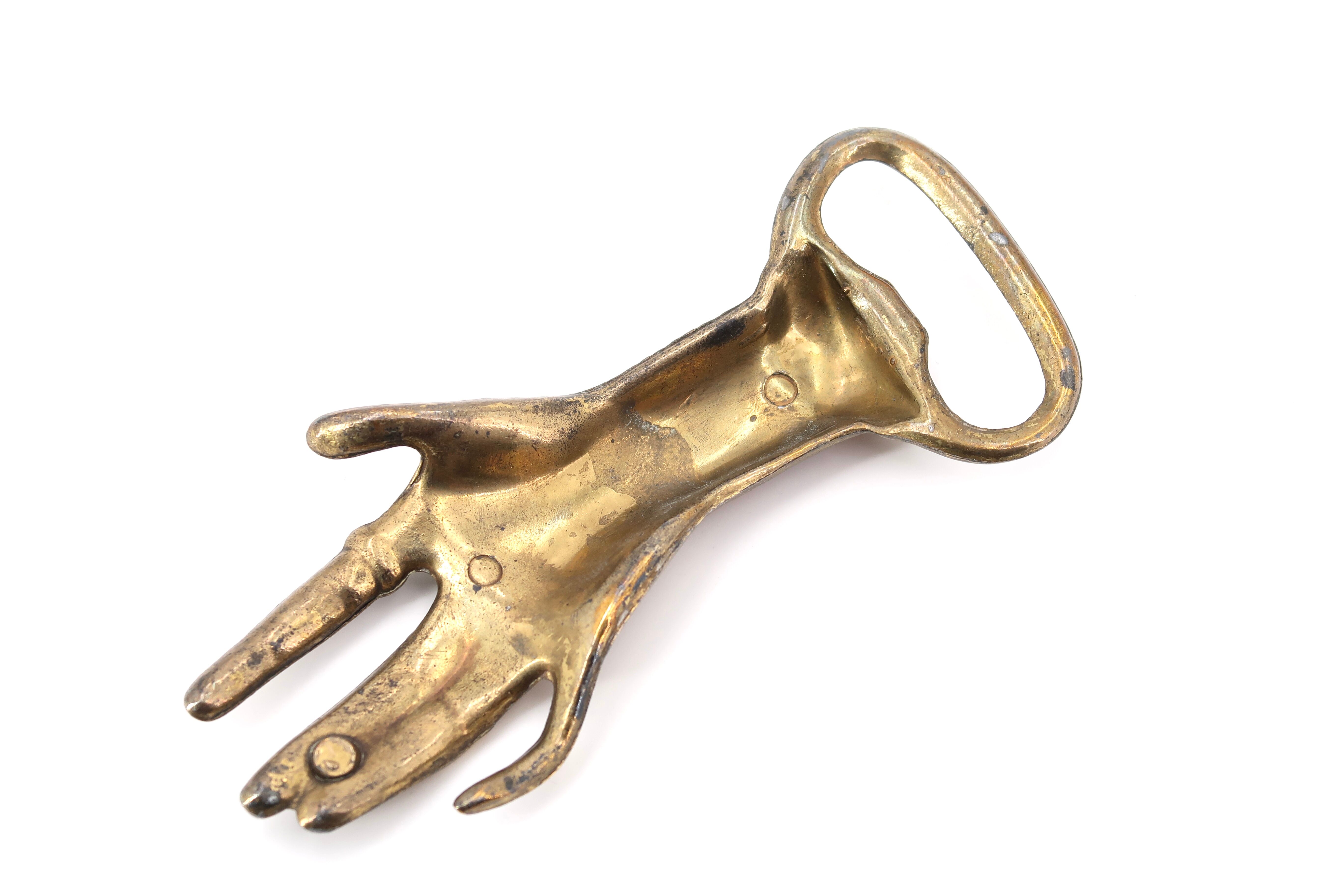 Brass hand bottle opener, 50s