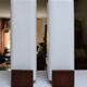 Pair of Louis Kalff wall lights, teak opalines from the 50s/60s.