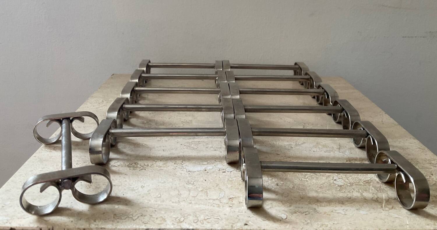 Series of 12 vintage stainless steel knife holders