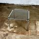 Table basse vintage en métal chromé et verre fumé