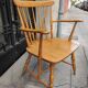 Four chairs and a Heywood Wakefield Windsor armchair. Vintage