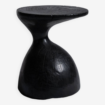 End table in solid wood (monoxyle) organic shape black color