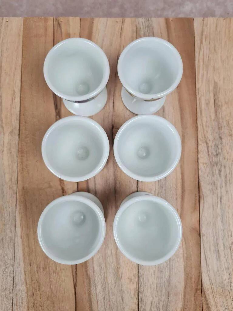 Set of 6 antique egg cups in porcelain from Paris + wooden stand