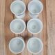 Set of 6 antique egg cups in porcelain from Paris + wooden stand