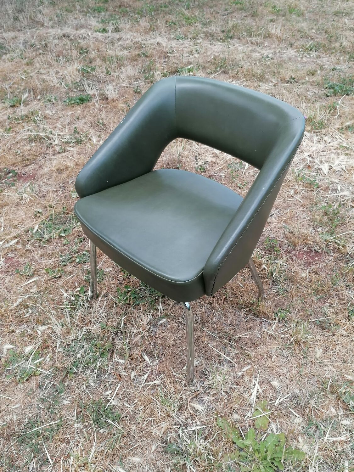 Vintage conference armchair in green skai Roset SNA