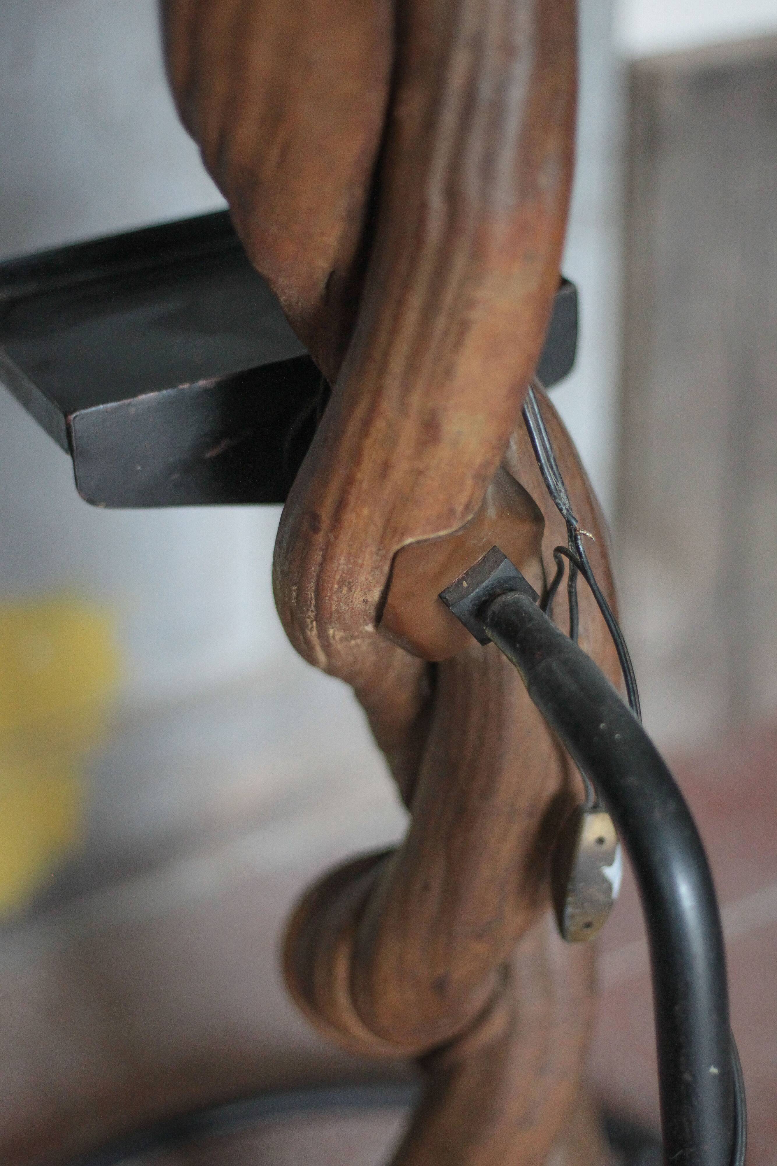 Liane and metal floor lamp with perforated leather shade featuring elephant patterns, lise.