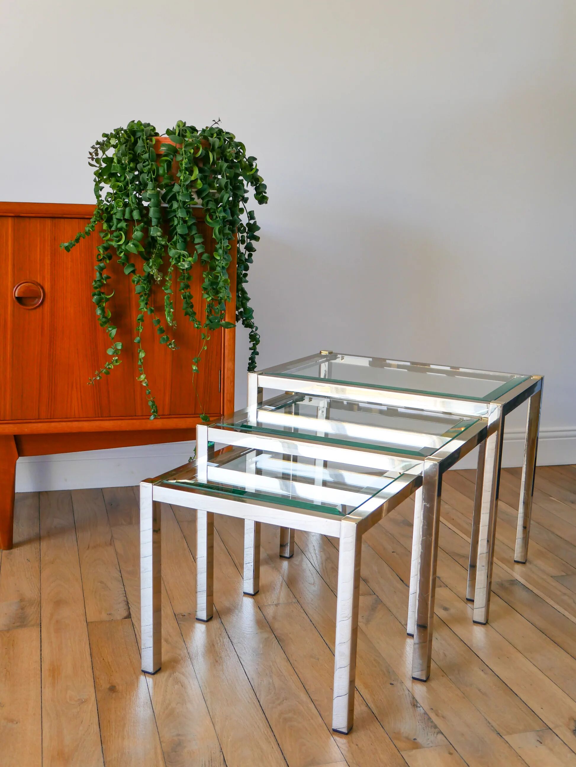 Set of three nesting coffee tables, gilt brass with beveled glass tops, 1980