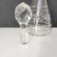Crystal bottle with silver metal neck rim
