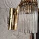 Brass wall light with crystal pendants