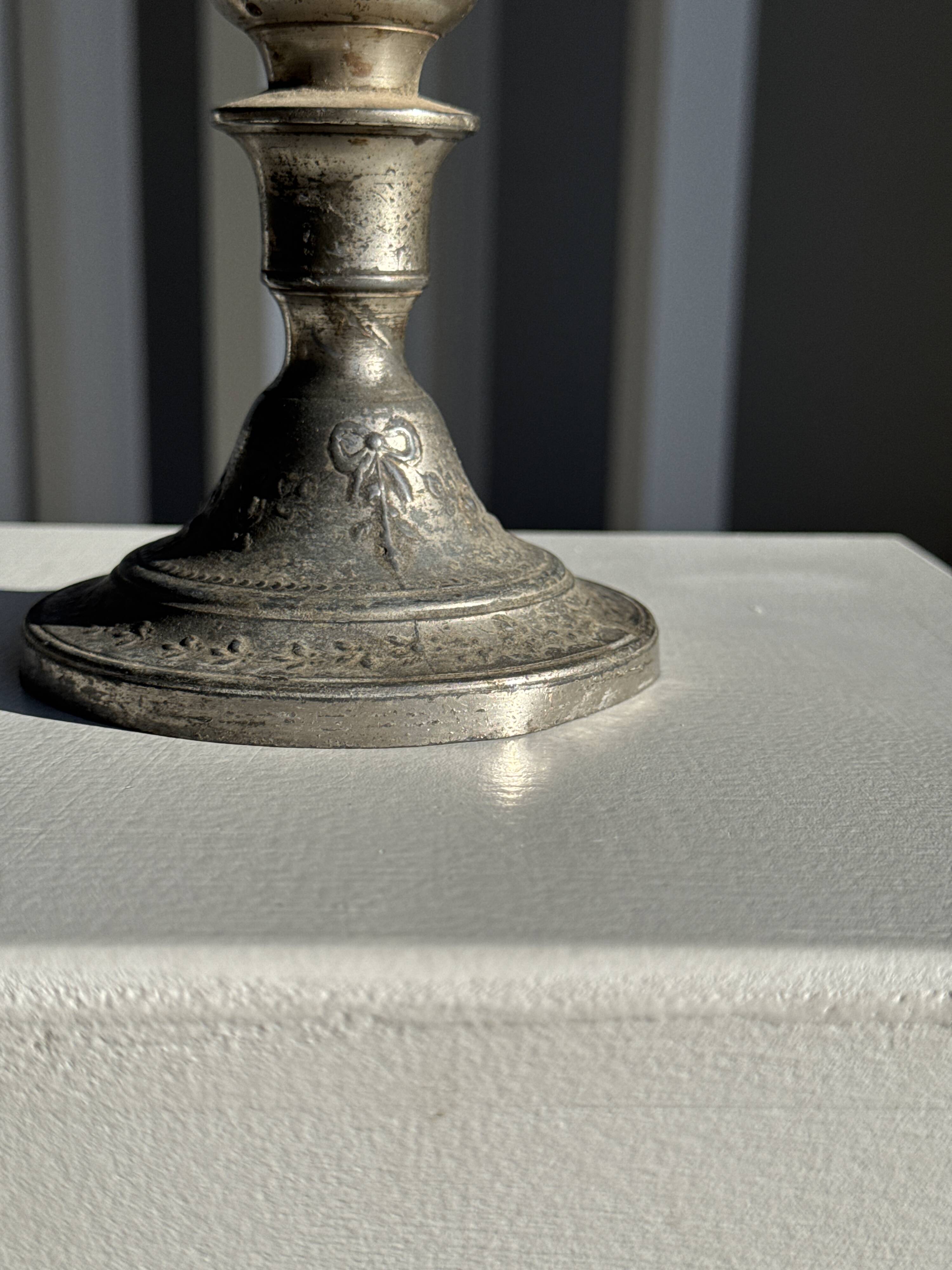 Small antique candle holder engraved in silver-plated metal, in its original condition.