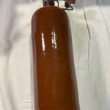 Old bottle in sandstone with a mechanical porcelein cap