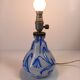 Antique table lamp in opaline glass with blue floral decoration.