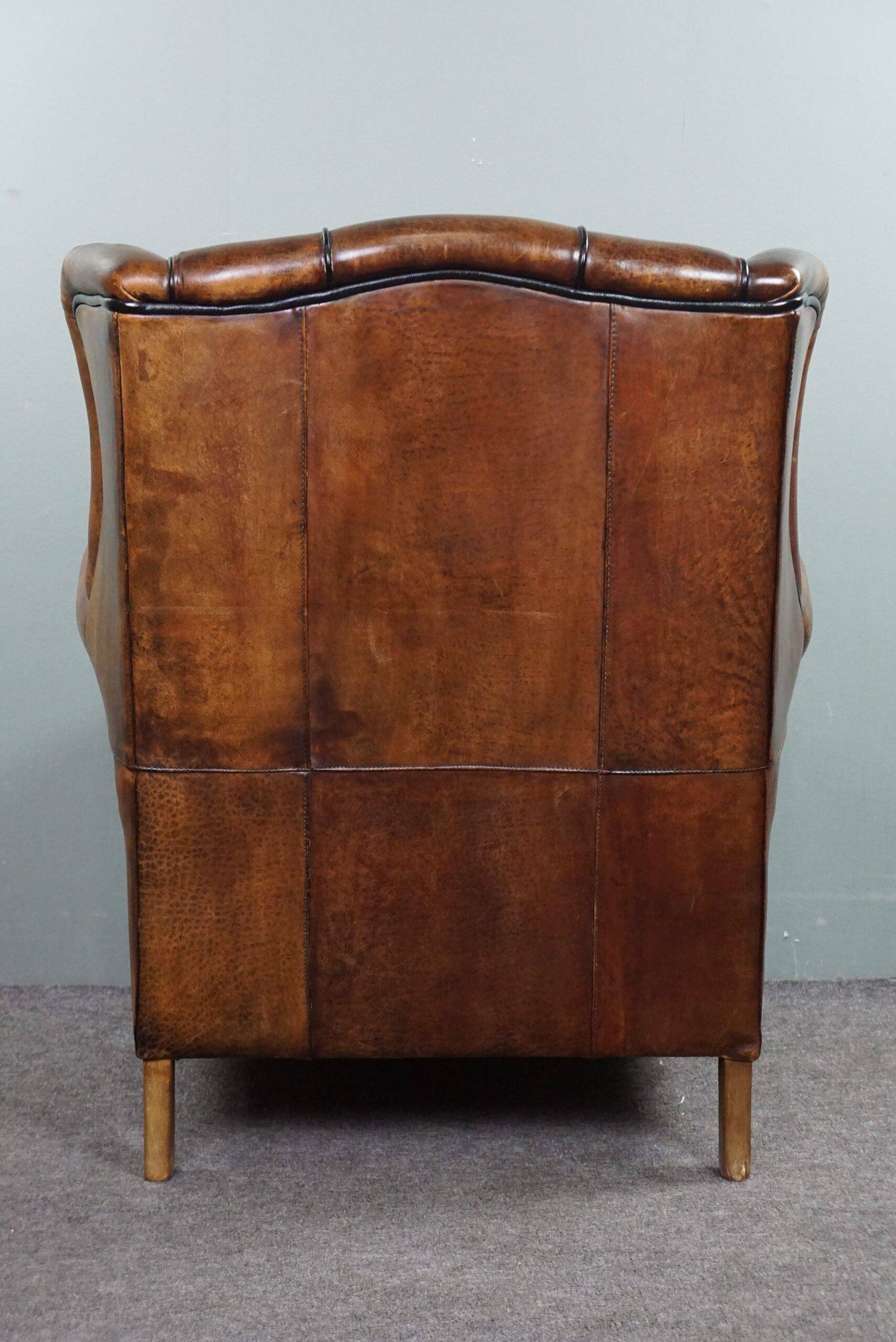 Fauteuil à oreilles en cuir de mouton