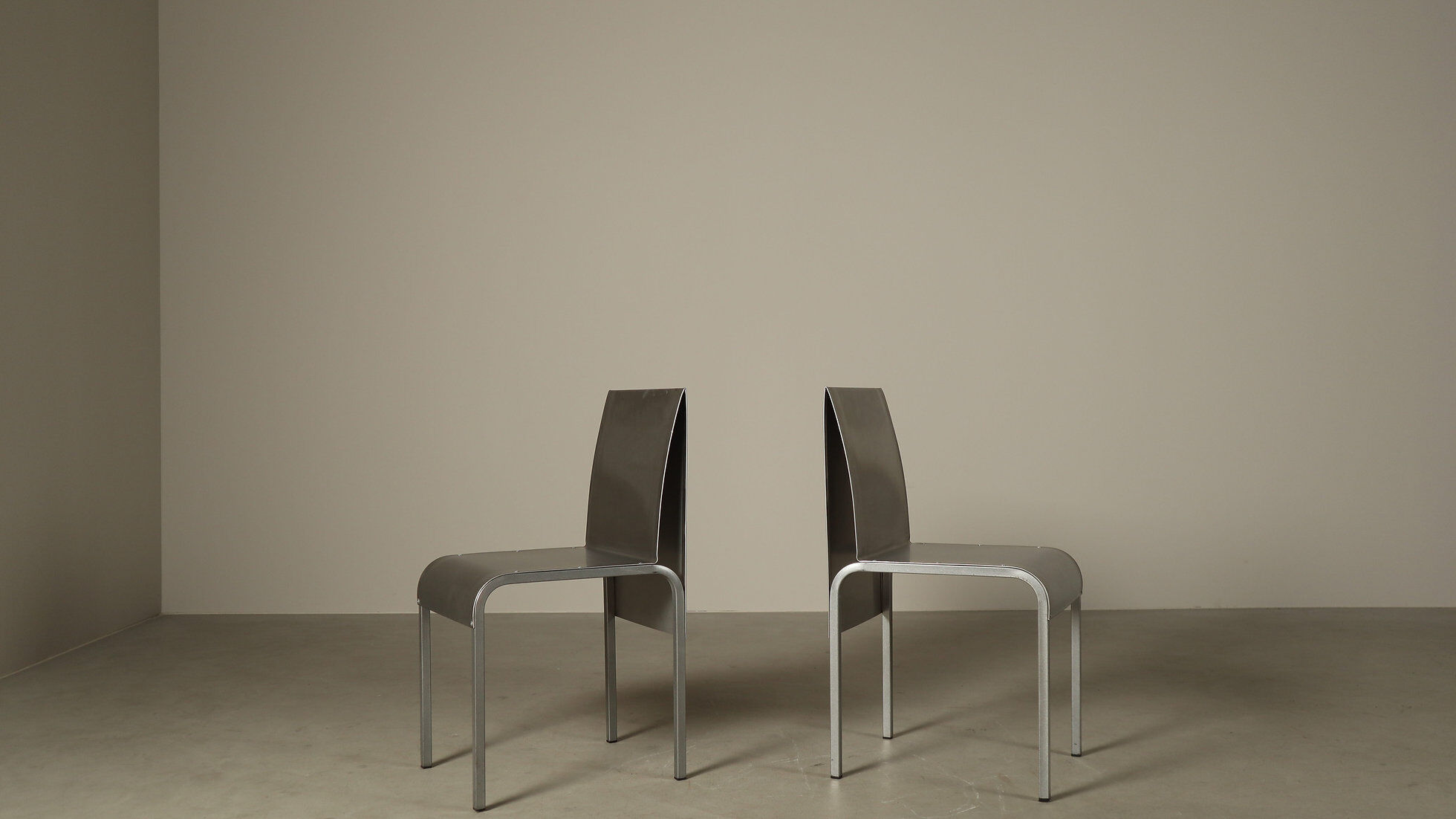 Set of six postmodernist stainless steel dining chairs from circa 1980-1990.