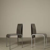 Set of six postmodernist stainless steel dining chairs from circa 1980-1990.