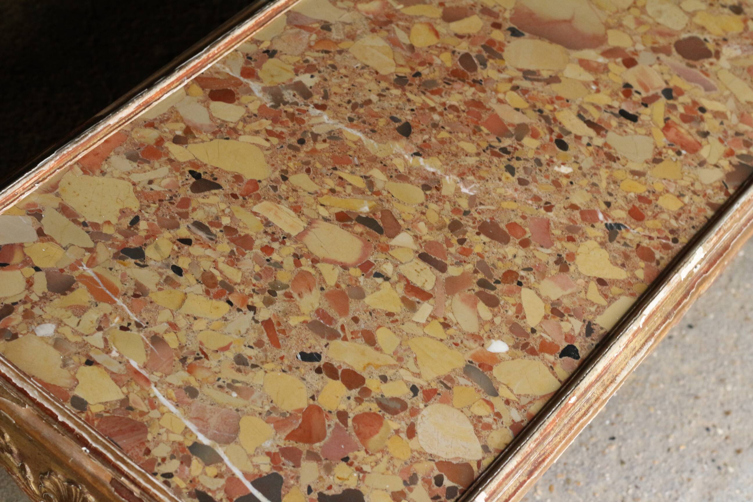 19th century coffee table. Gilded stucco and marble.