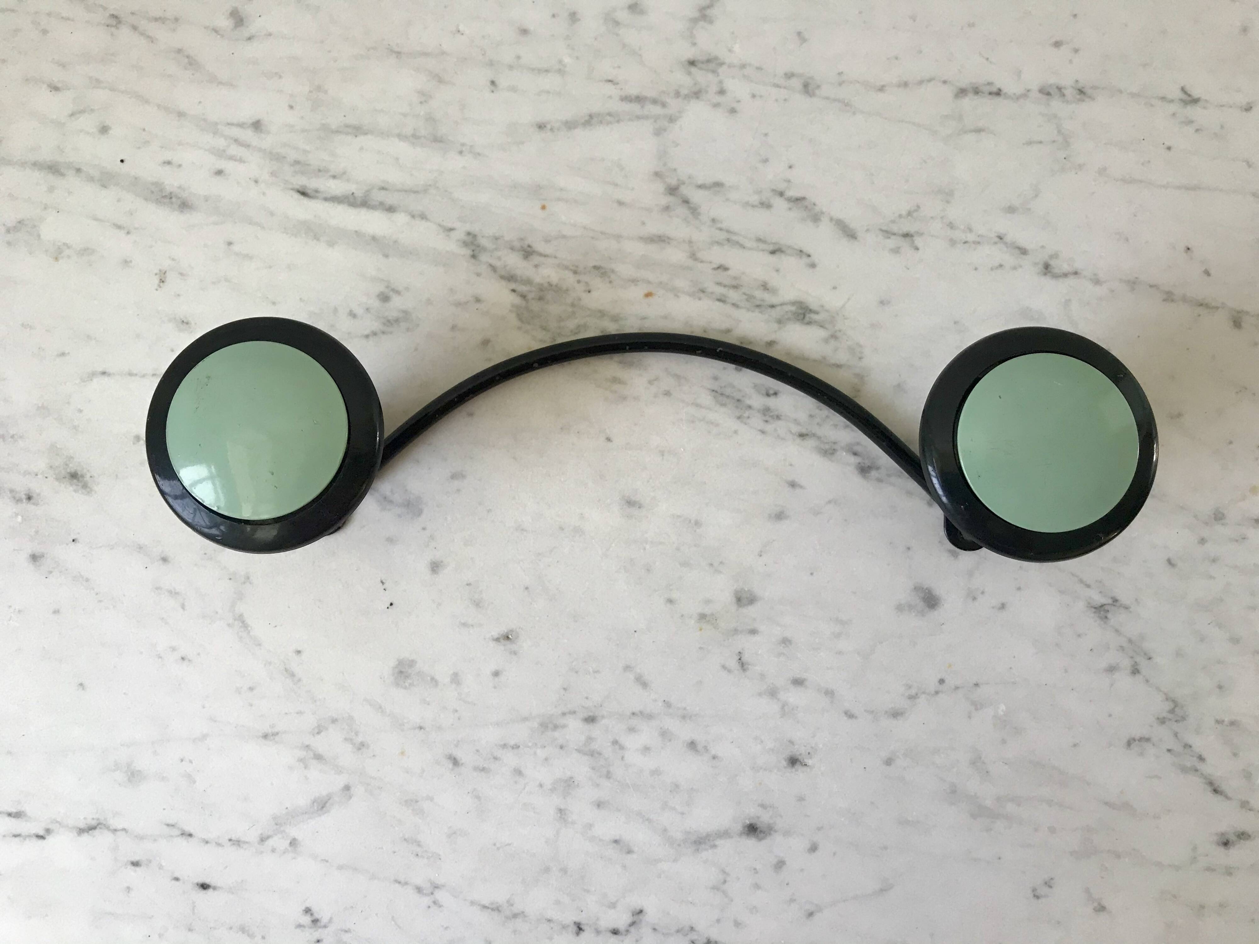 Design coat hook in sage green and black metal from the 70s