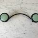 Design coat hook in sage green and black metal from the 70s