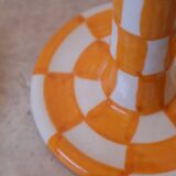 Pair of yellow and white checkered ceramic candlesticks