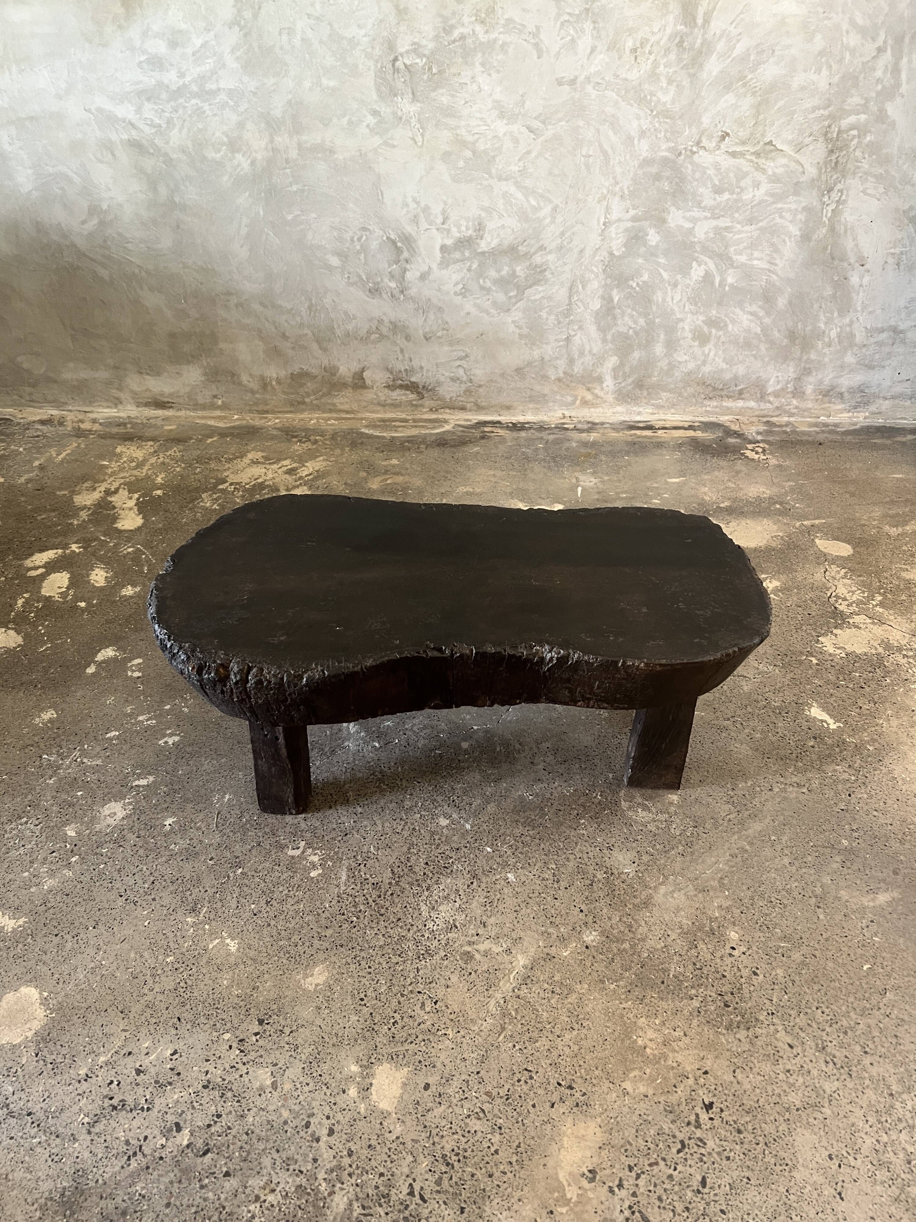 Small old Asian wooden coffee table in Japanese style, kidney-shaped top
