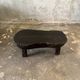 Small old Asian wooden coffee table in Japanese style, kidney-shaped top