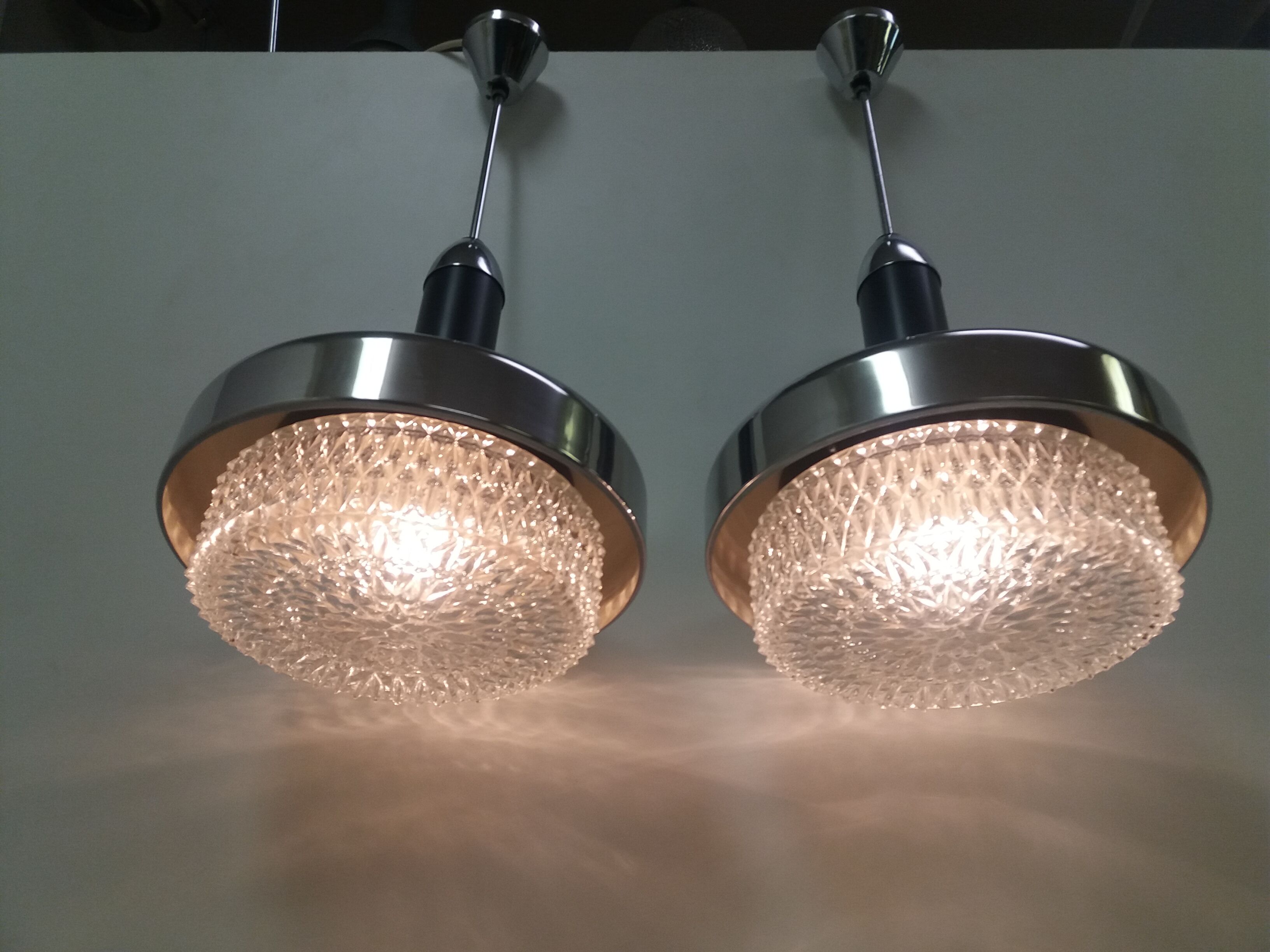 Pair of design metal chandeliers, Napako/UFO, 1970's.