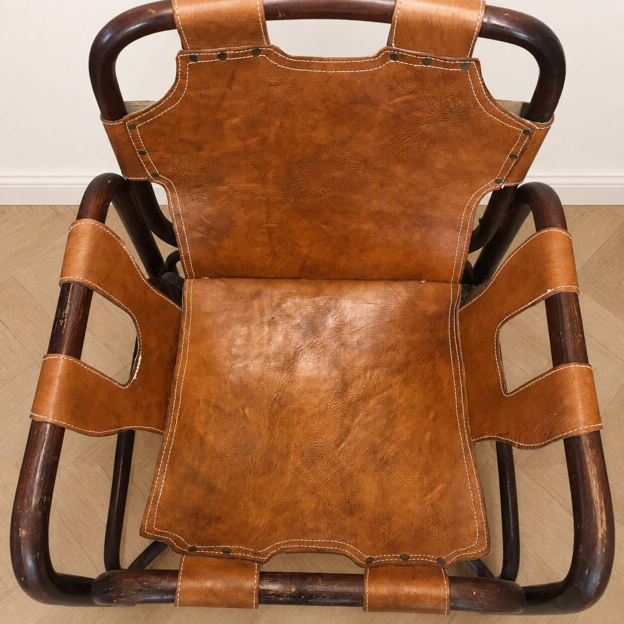 Pair of Tito Agnoli armchairs in leather and bamboo, 1970s.
