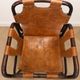 Pair of Tito Agnoli armchairs in leather and bamboo, 1970s.