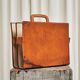 Trompe-l'Oeil magazine rack 'Actentasche' in patinated leather and canvas