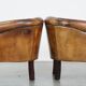 Set of 2 subtle, stately and sturdy club chairs made of sheepskin