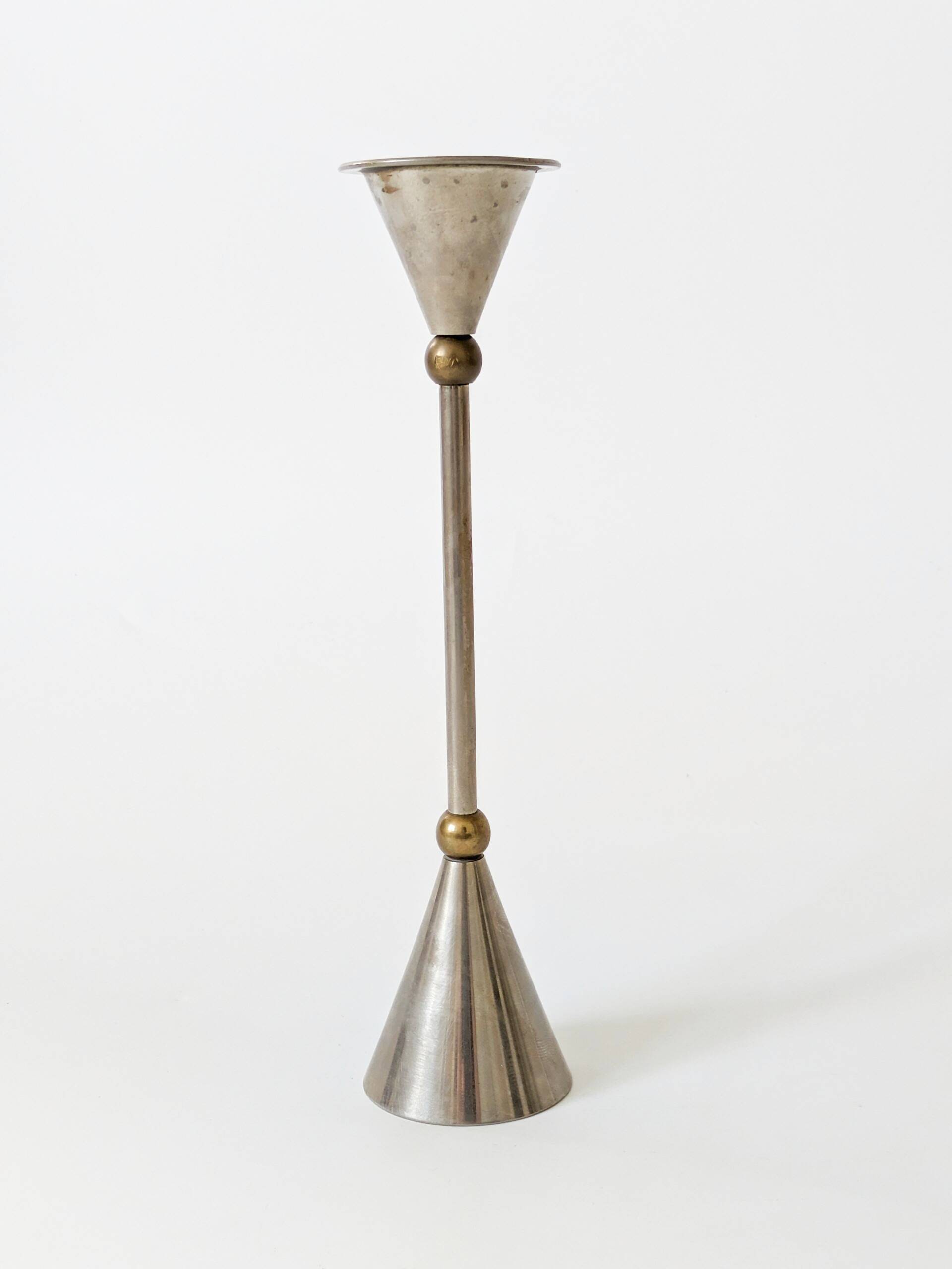 Pair of postmodern candlesticks in Memphis style made of steel and brass.