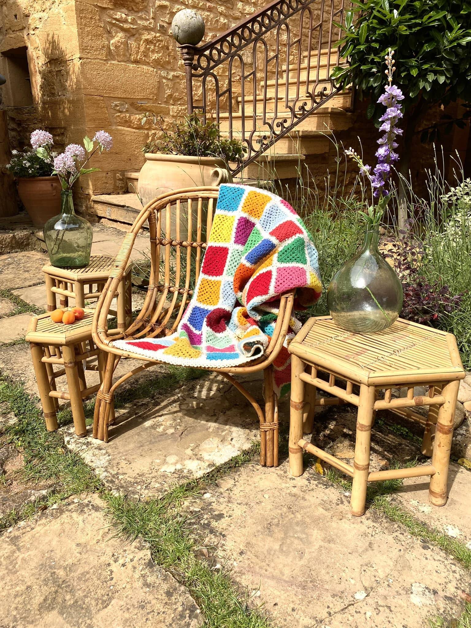 Set of three vintage rattan side tables.