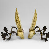 Pair of Hollywood Regency sconces in carved, painted and patinated wood, 1950s