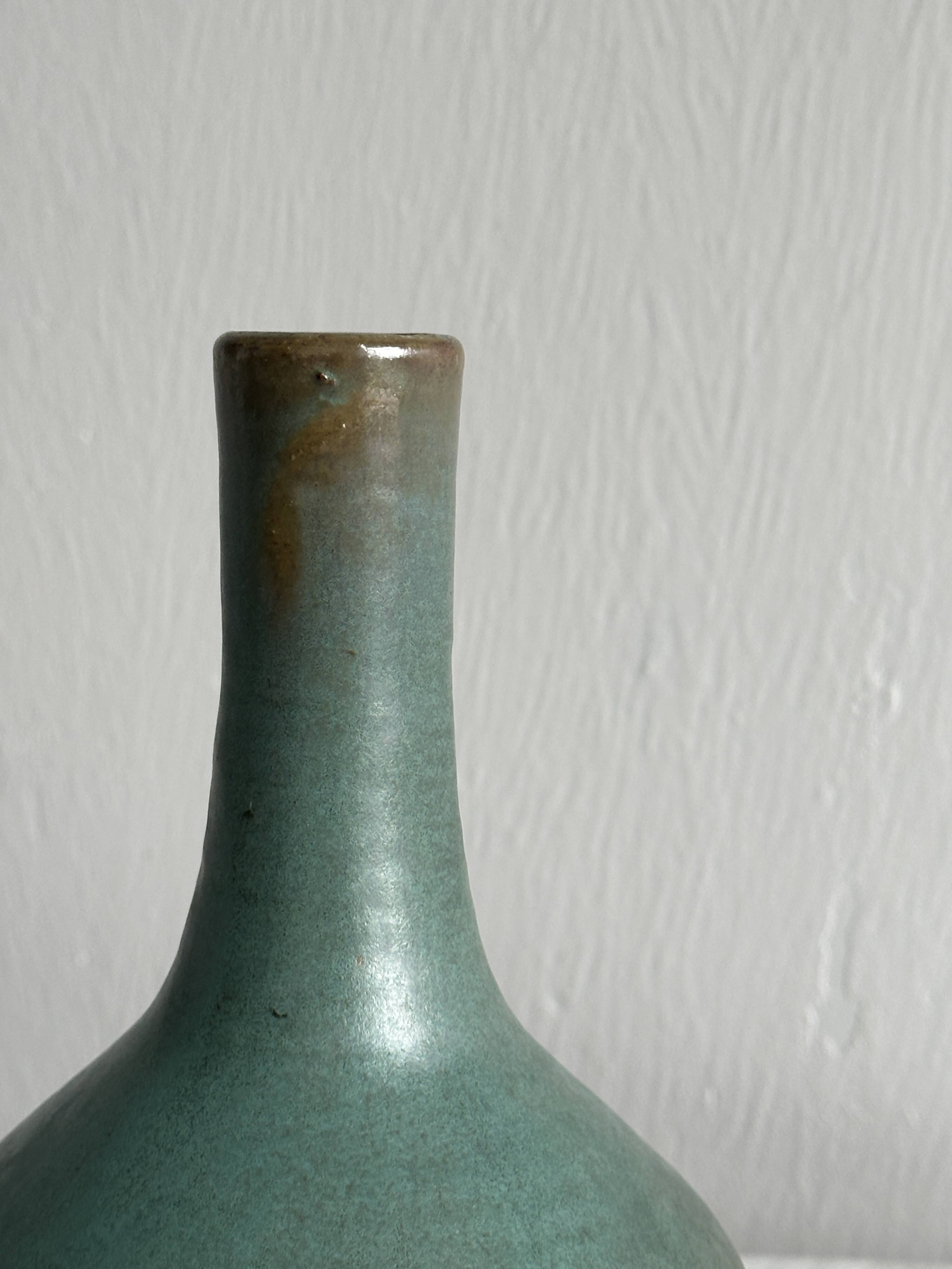 Green glazed ceramic vase