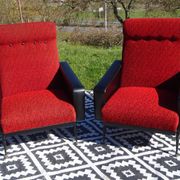 Pair of vintage armchairs in black faux leather and red fabric.