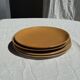 Set of 4 vintage stoneware plates, including 2 with floral motifs