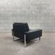Pair of black leather armchairs