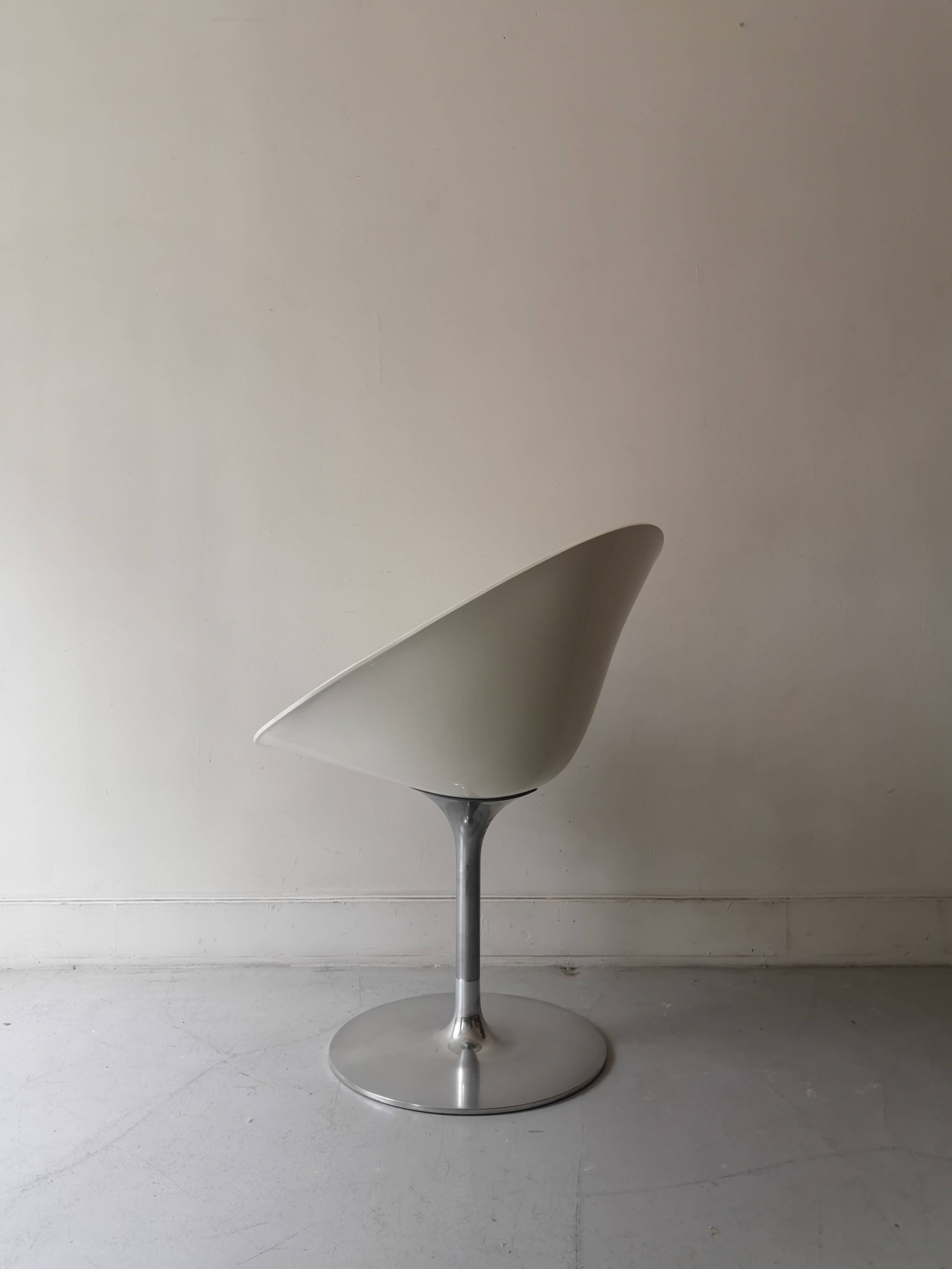 Ero swivel armchair in metal and white shell, p. starck design for kartell