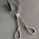 Cake tongs and spoon to sprinkle silver metal