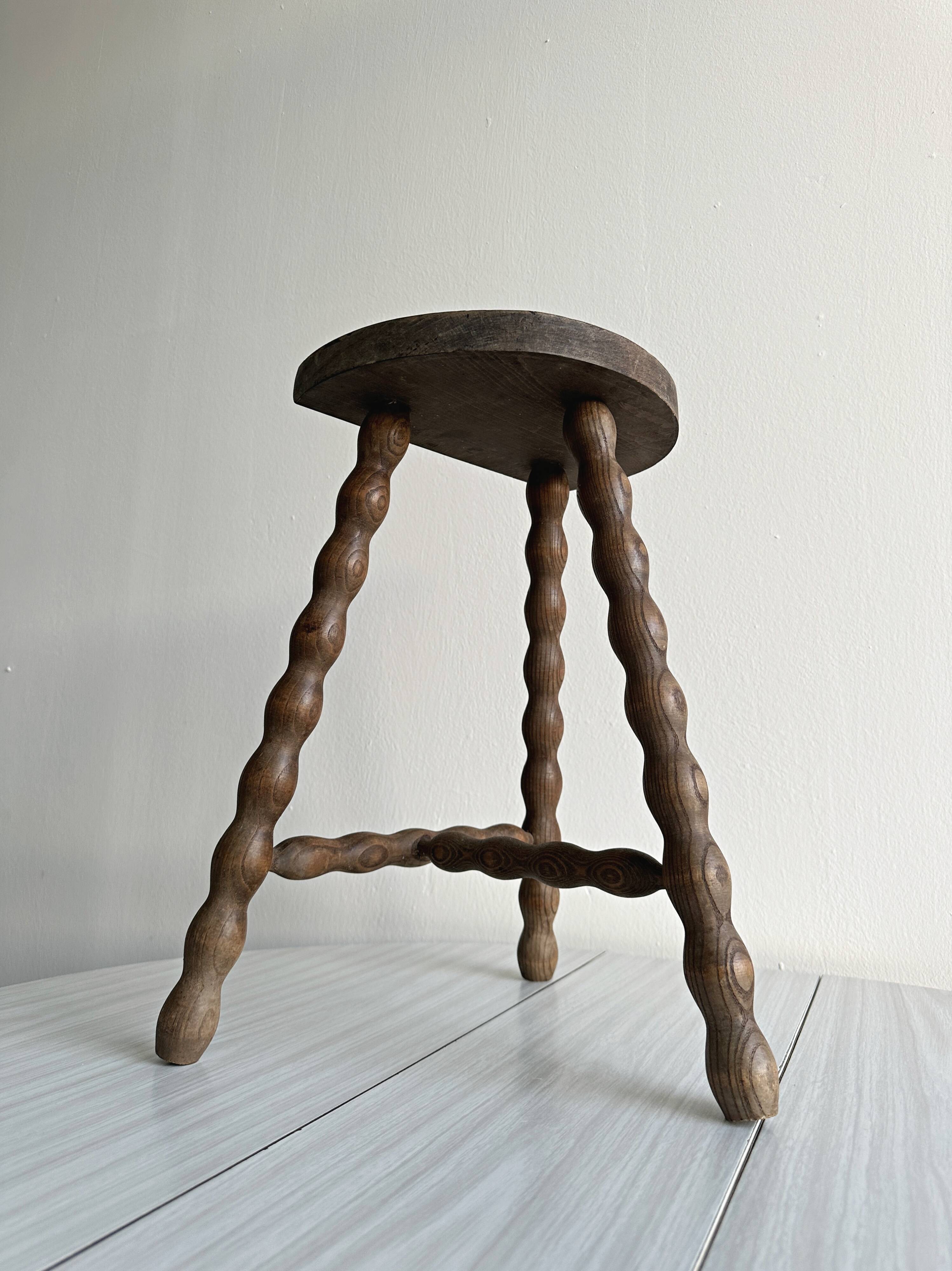 Tripod stool with turned wooden legs