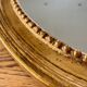 Antique gold oval mirror